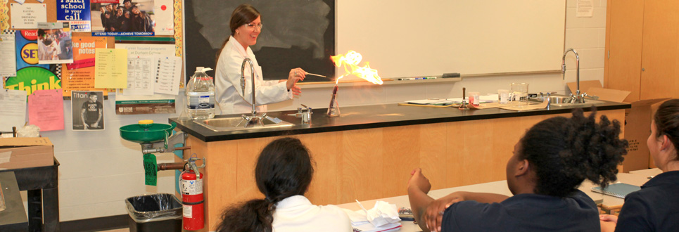 Teacher in a science lab demonstrating an experiment