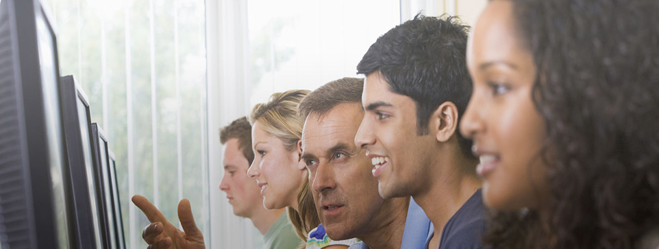 Male and female students on computers