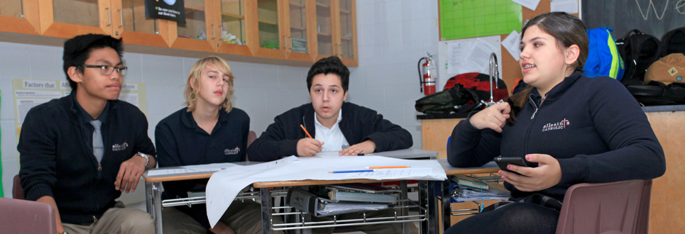 Four male students in a classroom