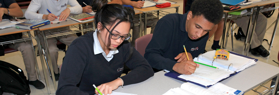 A group of students working in a classroom.